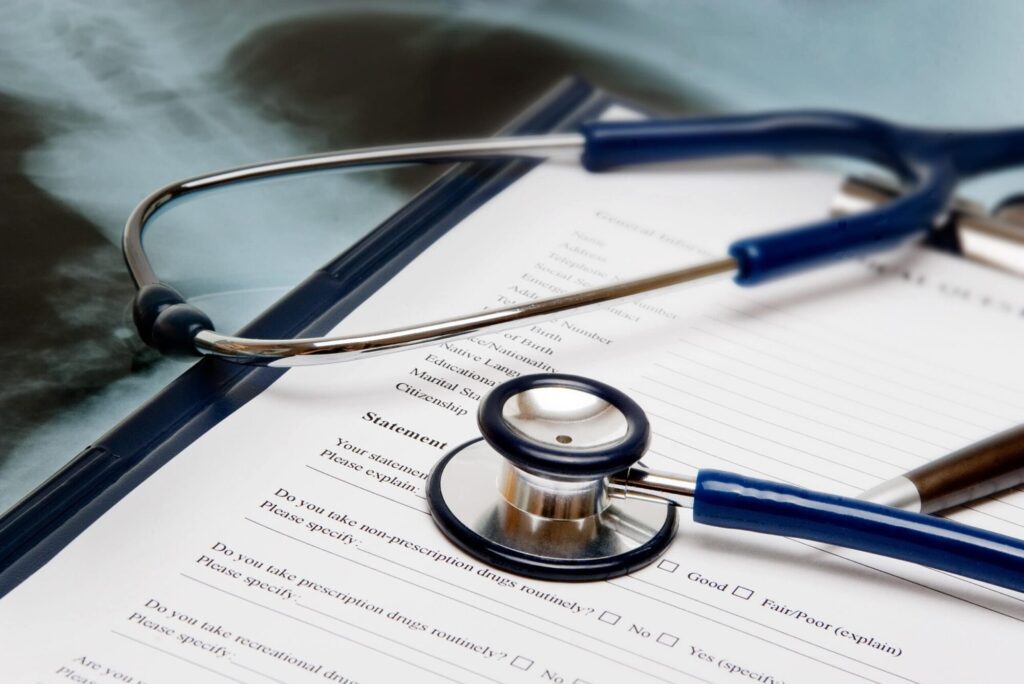 Close up image of a stethoscope kept on a paper